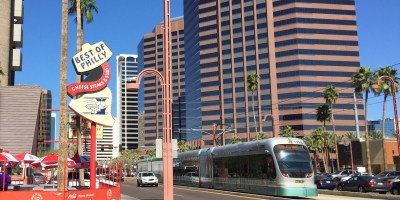 exterior of Best of Philly with a light rail train on Central Avenue