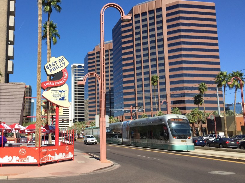 exterior of Best of Philly with a light rail train on Central Avenue