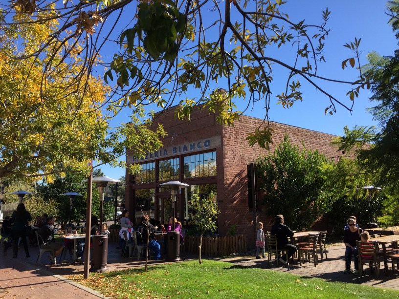 exterior of PIzzeria Bianco with customers seated outside