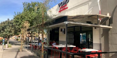 exterior of Pomo with customers on the patio