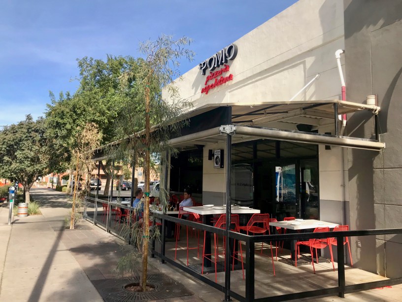 exterior of Pomo with customers on the patio