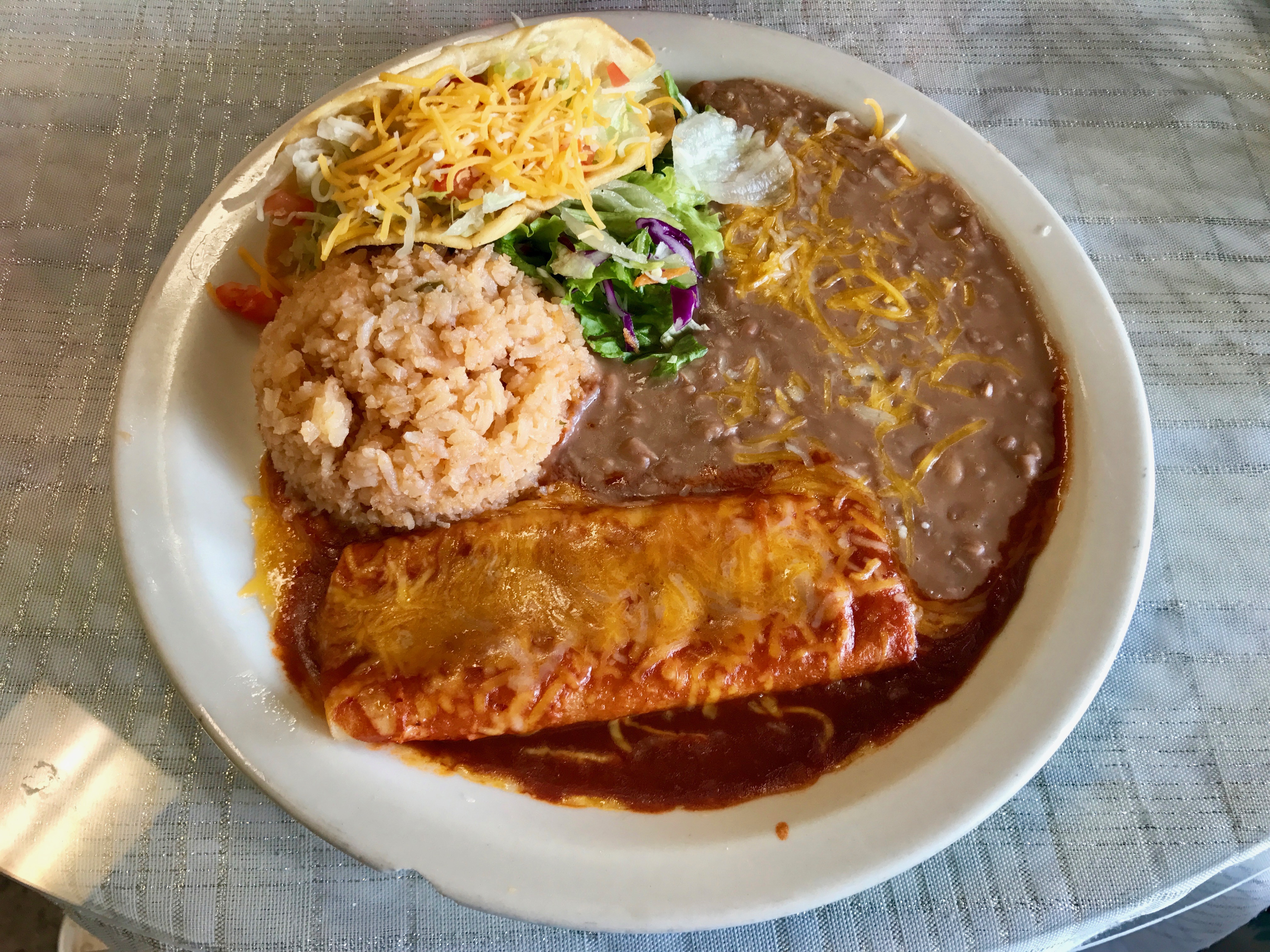 #1 combo: shredded beef taco, cheese enchilada, rice, and beans
