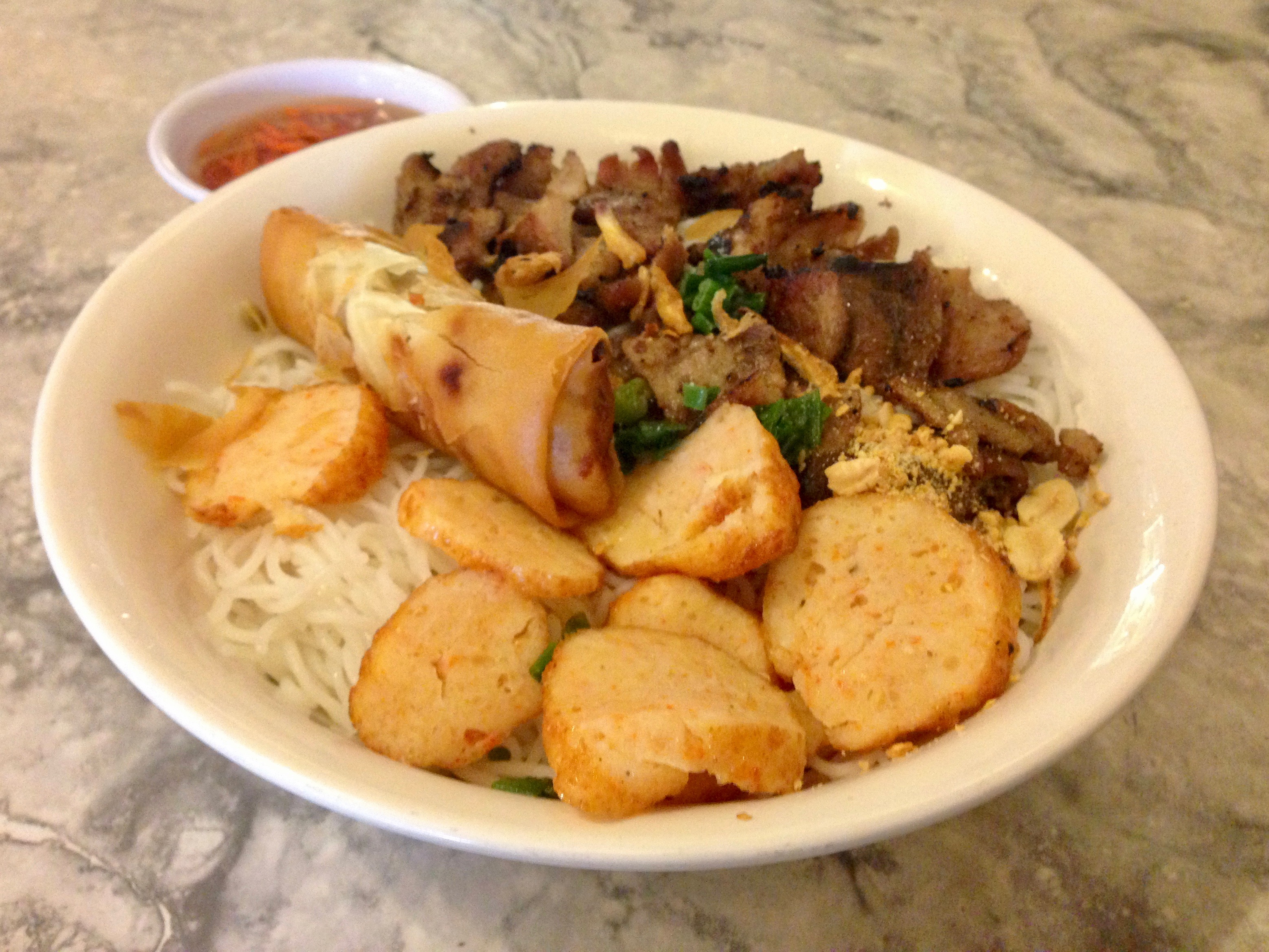 bun chao tom cha bo nuong (shrimp cakes, egg rolls, and grilled beef over rice vermicelli)