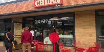 exterior of Churn with customers waiting to order