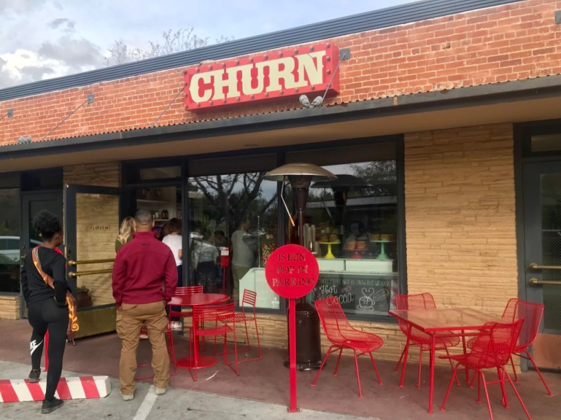 exterior of Churn with customers waiting to order