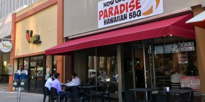 exterior of Paradise Hawaiian BBQ with customers seated on the patio