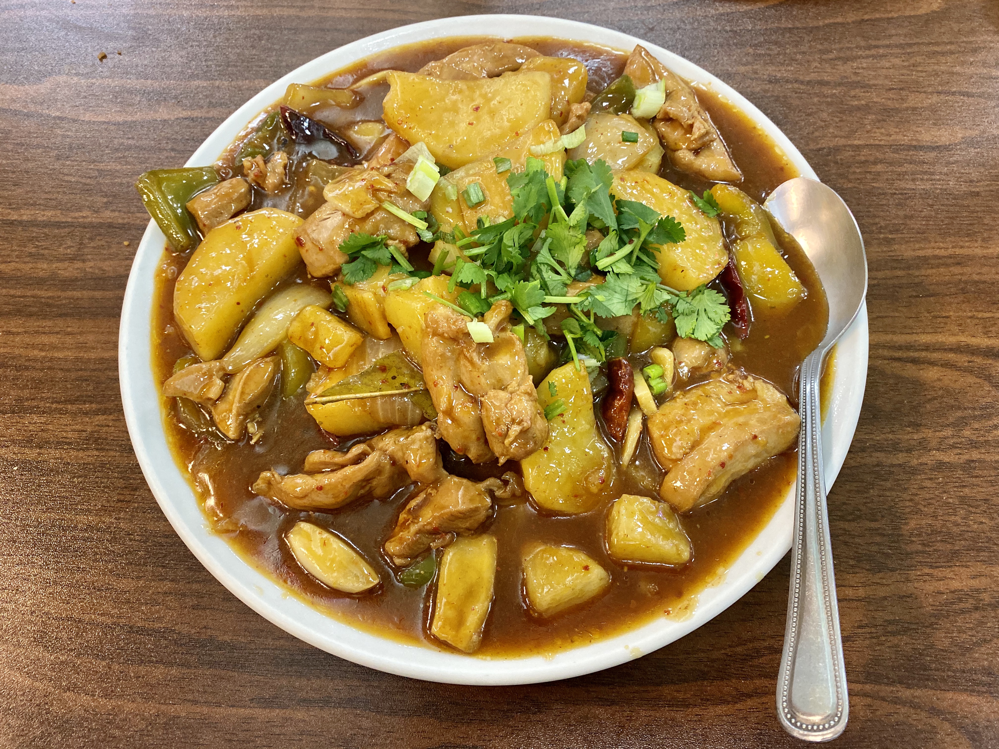 stewed spicy chicken with potatoes and peppers
