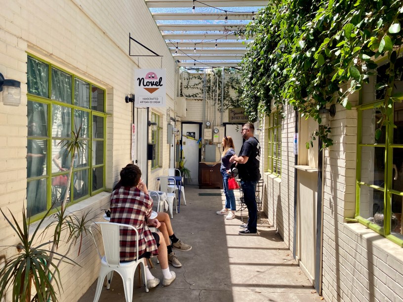exterior of Novel Ice Cream with customers in the courtyard