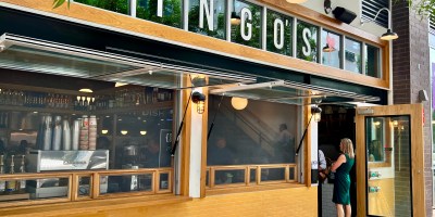 exterior of Ingo's with customers waiting in line to order