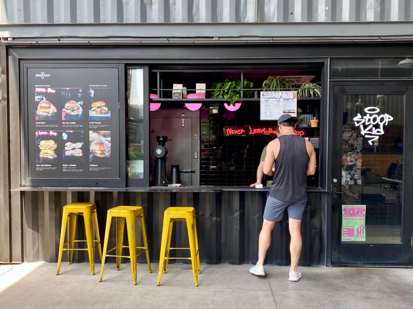 person ordering at the counter of Stoop Kid