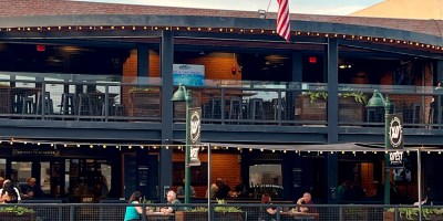 exteiior of 12 West with customers seated on the patio