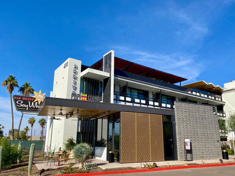 exterior of Arrive hotel with Pop Stand sign