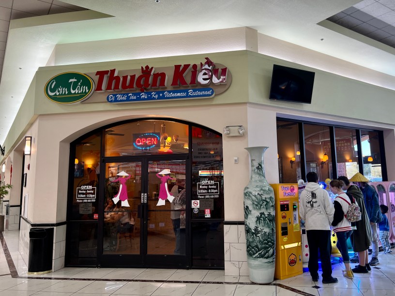 exterior of Com Tam Thuan Kieu with Mekong Plaza shoppers outside