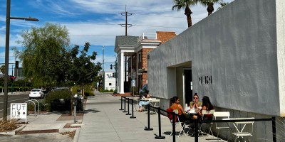 exterior of Futuro with people seated outdoors