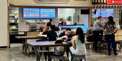 view of Da Pan with people seated in the food court