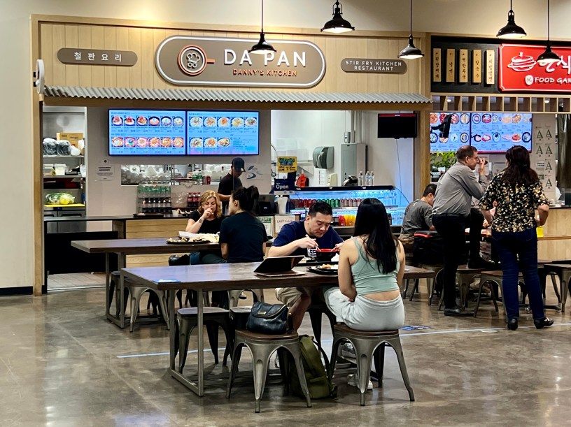 view of Da Pan with people seated in the food court