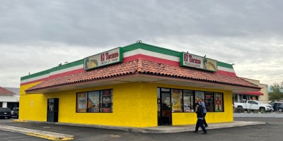 exterior of El Tacazo with customers walking towards the entrance