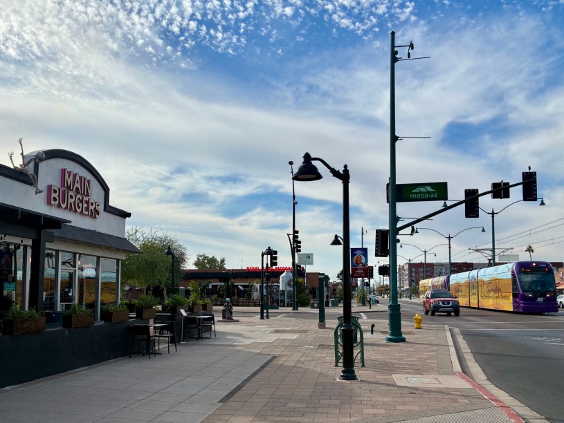 exterior of Main Burgers with a light train approaching on Main Street