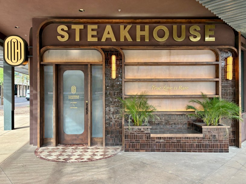 entrance of Cleaverman with the word "steakhouse" in large letter above and the phrase "true love is rare" on the window