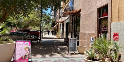 exterior of Sweet Crimes as seen along Adams Stree with sandwich board signs on the sidewalk