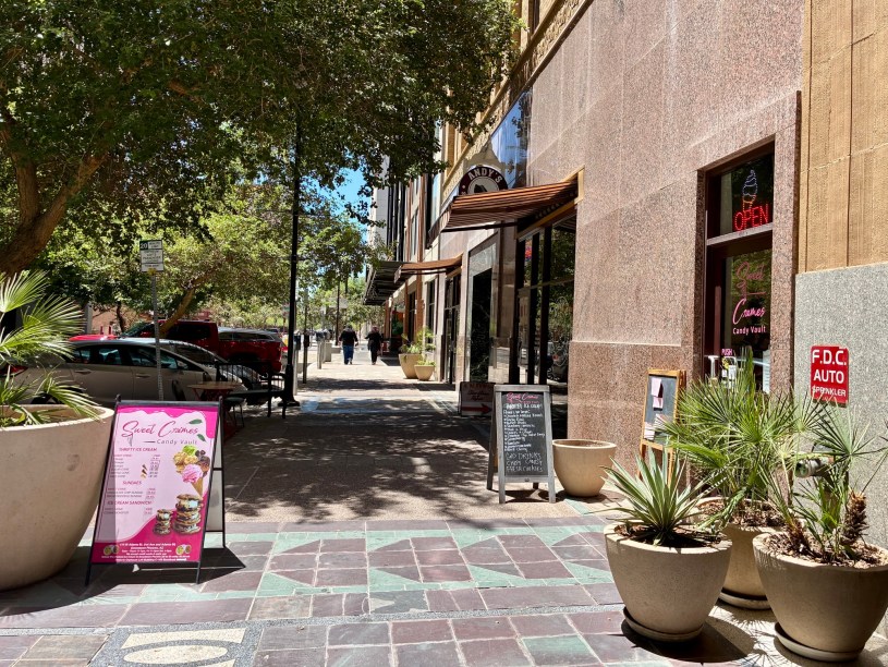 exterior of Sweet Crimes as seen along Adams Stree with sandwich board signs on the sidewalk