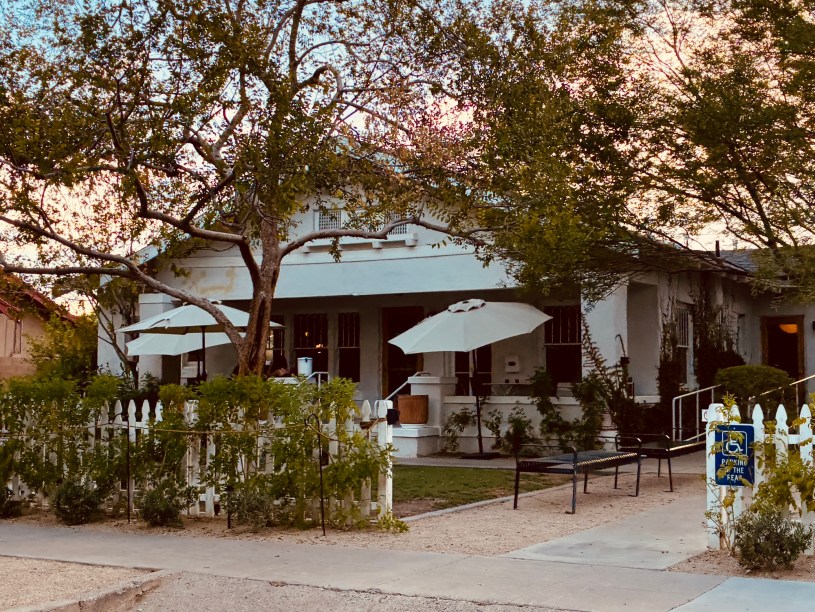 exterior of Matilda's with shade trees and diners eating on the patio